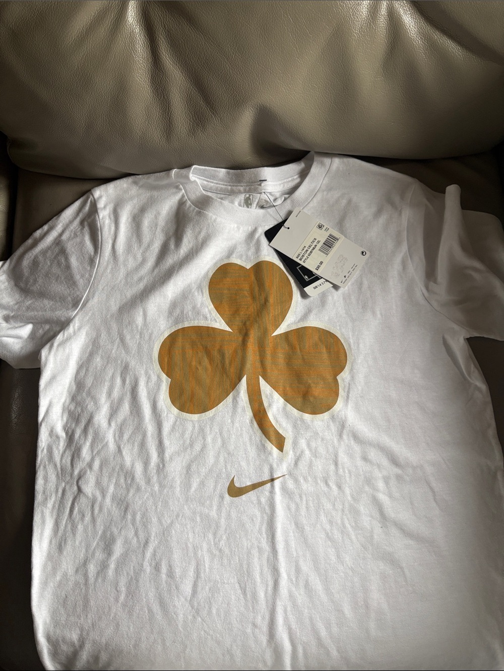 Nike White Short-Sleeve Tee with Gold Shamrock Graphic